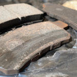 The right rear brake pads with a good one for size comparisson.